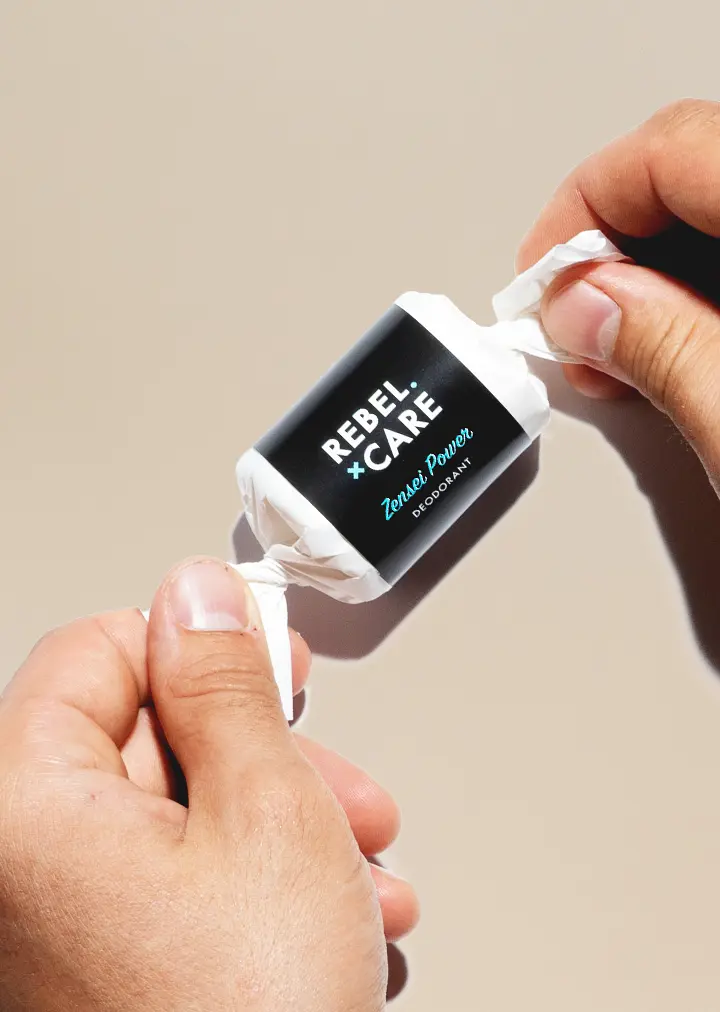 Hands-unwraping-zensei-power-refill Rebel care Zensei power deodorant refill with hands unwrapping